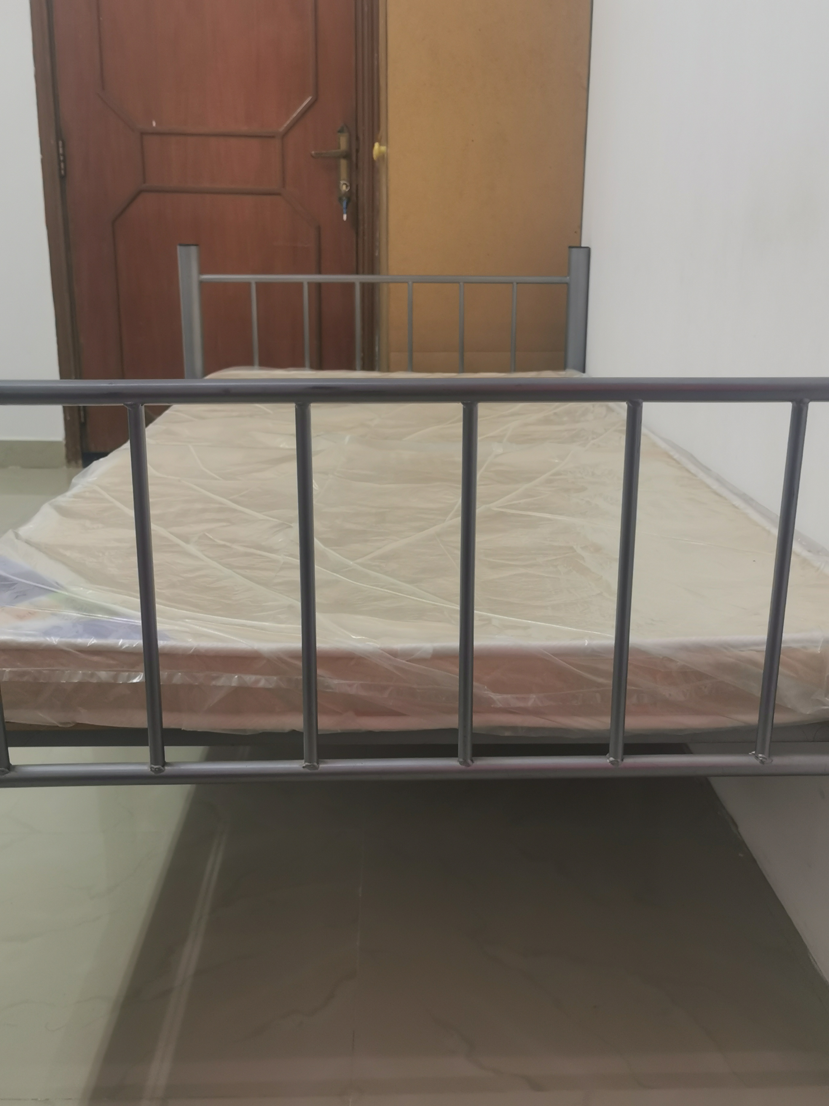 STEEL BED WITH PLYWOOD AND MATRESS - Image 1