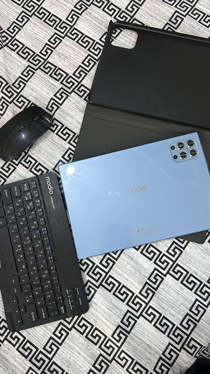 Modio tablet with mouse, keyboard, protective cover, screen protector, and charger. Specifications: 512GB storage, Android 13, powerful and capable of handling many applications. Used for only one month. Reason for selling: Lack of use. Price: 350 qr - Image 4