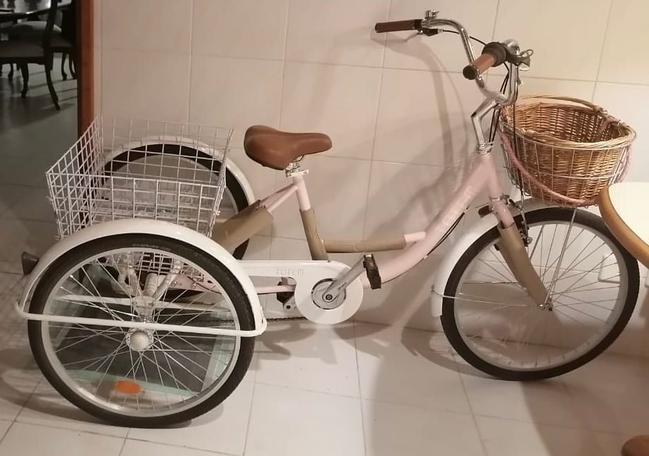 Pink tricycle with front basket and back basket - Image 1