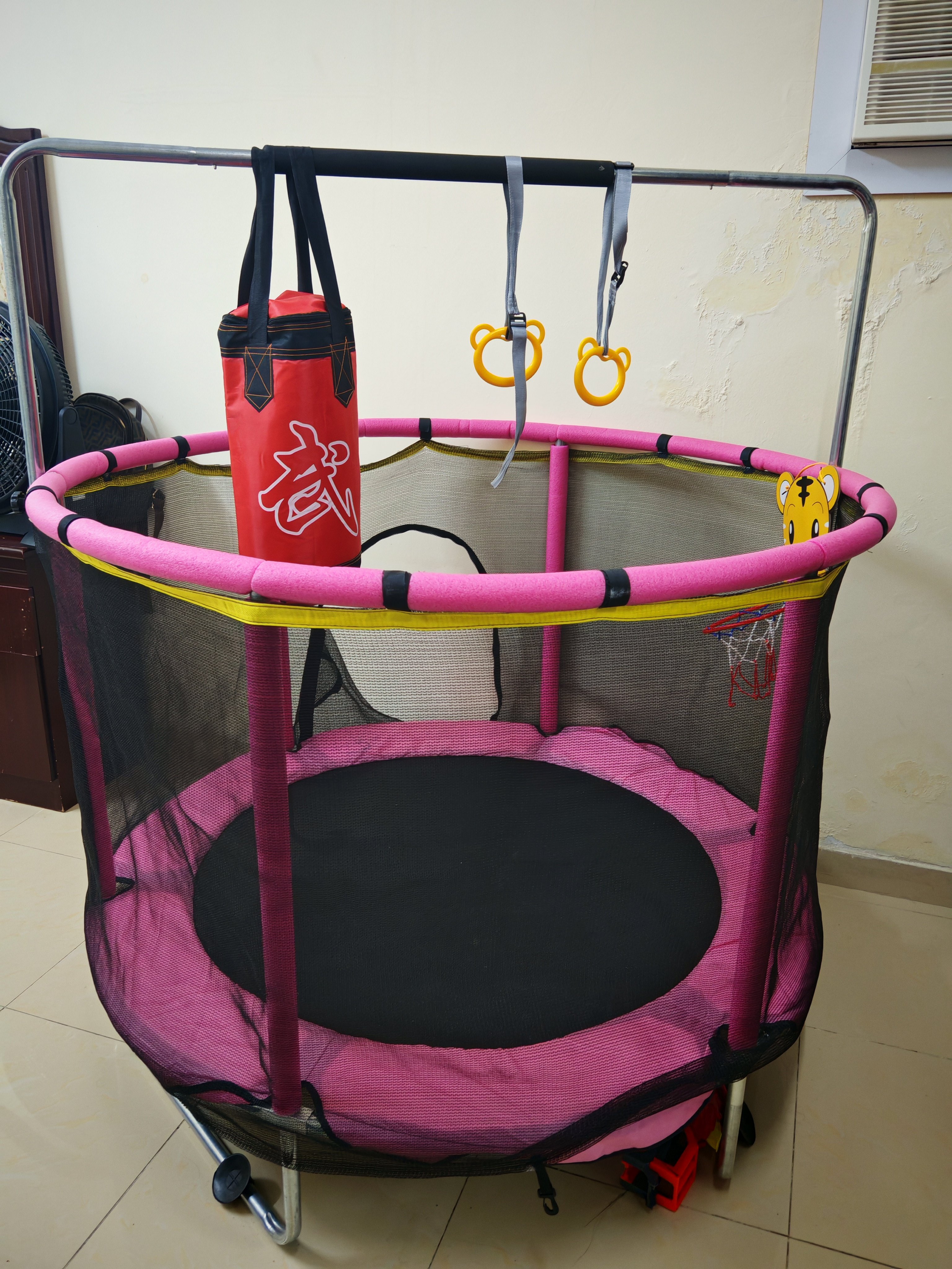 Kids Trampoline with Basketball Hoop & Punching Bag – Good Condition - Image 1