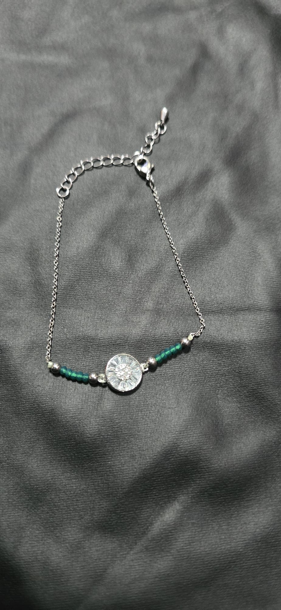 silver-tone chain bracelet featuring green beads - Image 1