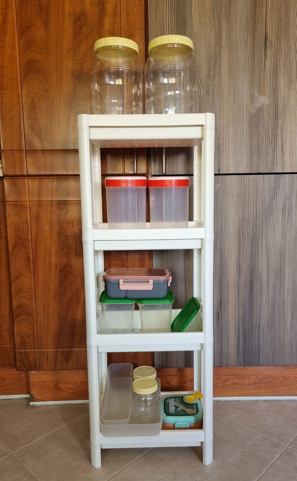 IKEA VESKEN 4-tier white shelf unit with assorted kitchen storage - Image 1
